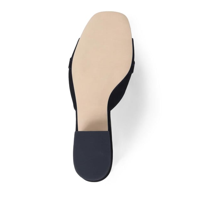 Step into effortless sophistication with these leather mules, accented with a gleaming golden chain for a hint of Jones elegance. Perfect for elevating your daytime look or complementing your evening ensemble, these heels are the epitome of chic versatility.