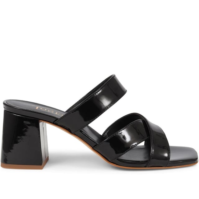 Stride with confidence in our slip-on mule sandals, featuring a chunky block heel that combines comfort with a touch of modern flair. These easy-to-wear mules are the perfect choice for adding a bold statement to your outfit, whether you're dressing up for a special occasion or simply elevating your everyday look.