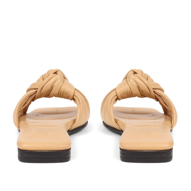 Spend summer with our Madelena mules. With their sleek leather design, cushioned footbed, and daringly minimalist silhouette, they're the perfect blend of elegance and simplicity.