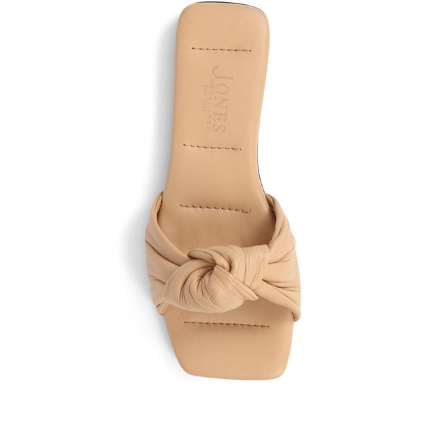 Spend summer with our Madelena mules. With their sleek leather design, cushioned footbed, and daringly minimalist silhouette, they're the perfect blend of elegance and simplicity.