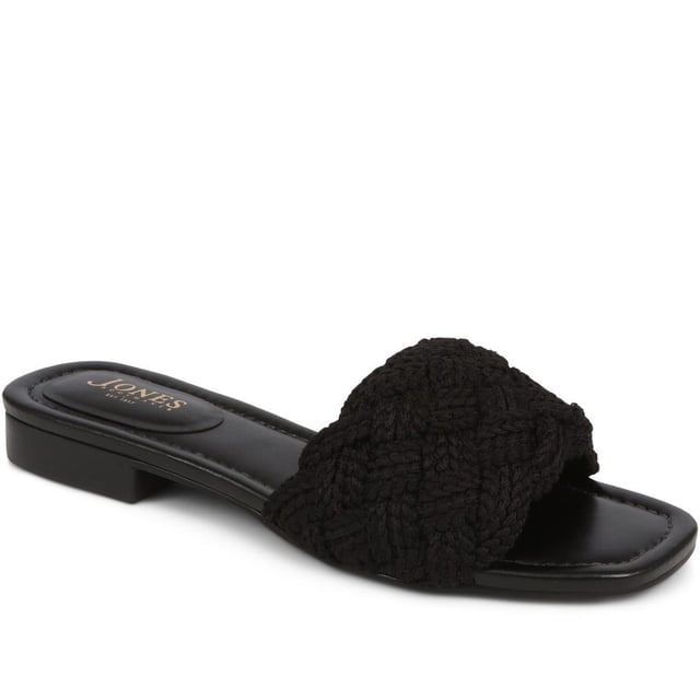 Slide into the textured embrace of these woven slide sandals, and channel artisanal charm and understated elegance. These are your go-to for a relaxed yet polished look that carries you through the summer with ease.