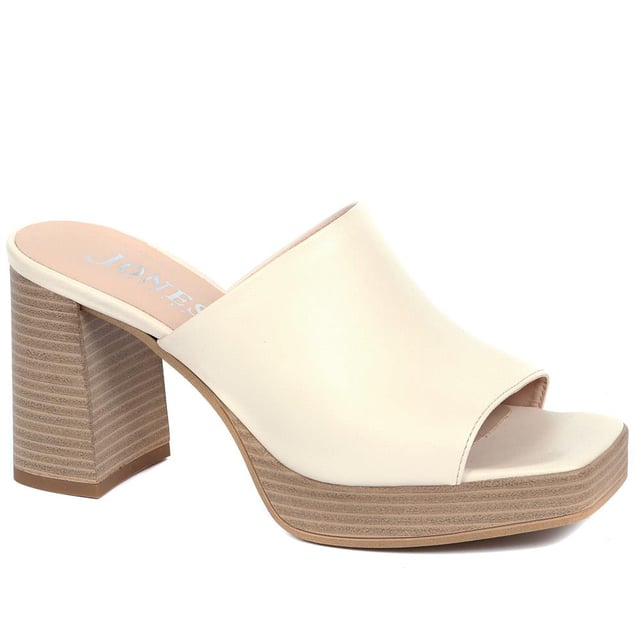 Tap into the unstoppable 90s trend with Dominica, the block heel mule that has all the nostalgic flare you need this season. Poised upon a chunky block wooden platform for added edge, these are the perfect pairing to cropped jeans, skirts or dresses.