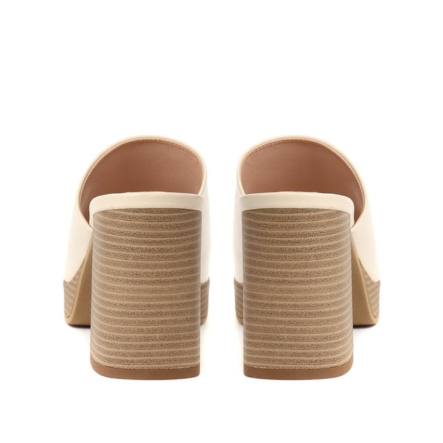 Tap into the unstoppable 90s trend with Dominica, the block heel mule that has all the nostalgic flare you need this season. Poised upon a chunky block wooden platform for added edge, these are the perfect pairing to cropped jeans, skirts or dresses.