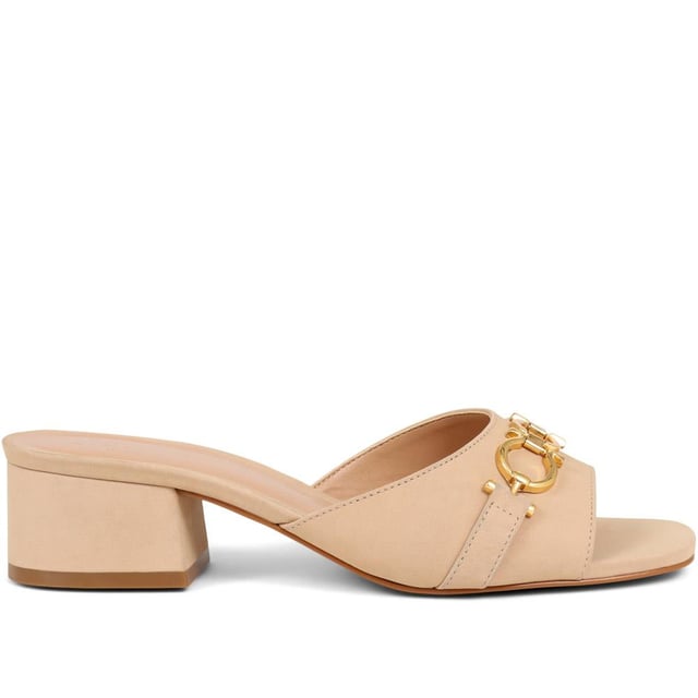Step into effortless sophistication with these leather mules, accented with a gleaming golden chain for a hint of Jones elegance. Perfect for elevating your daytime look or complementing your evening ensemble, these heels are the epitome of chic versatility.