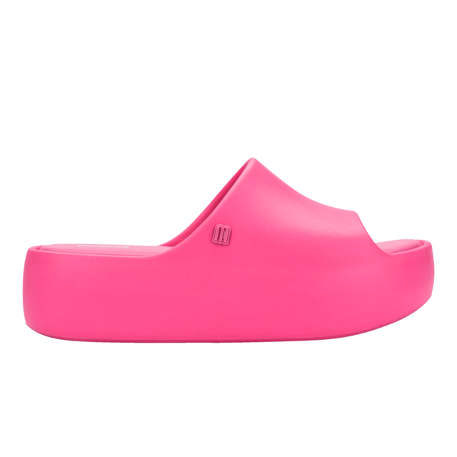 Free Platform Slide Pink Elevate the footwear game with the stylish and versatile Melissa Free Platform Slide, a style that won't let you down! The sustainable and modern Melissa Free line has delivered products that are EVA-based, lightweight, and in touch with current fashion trends. The slide has a robust design, but is unbelievably lightweight and comfortable, so much so that you will want them on ythe feet all day, every day.