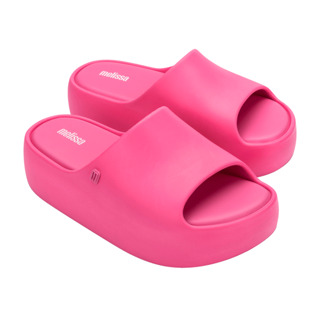 Free Platform Slide Pink Elevate the footwear game with the stylish and versatile Melissa Free Platform Slide, a style that won't let you down! The sustainable and modern Melissa Free line has delivered products that are EVA-based, lightweight, and in touch with current fashion trends. The slide has a robust design, but is unbelievably lightweight and comfortable, so much so that you will want them on ythe feet all day, every day.