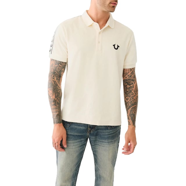 True Religion Mens Polo Shirt
Style Code:  107563
100% Cotton
Made in India
Signature Horseshoe on The Chest
Logo Trim Down The Shoulder Seam
Short Sleeve
Ribbed Collare & Sleeve
Soft Cotton Fabric
Regular Fit
Machine Washable
Split Side Hem