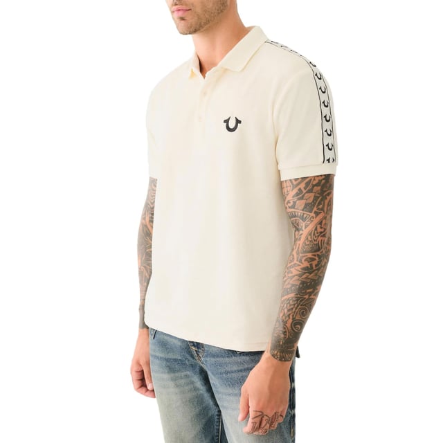True Religion Mens Polo Shirt
Style Code:  107563
100% Cotton
Made in India
Signature Horseshoe on The Chest
Logo Trim Down The Shoulder Seam
Short Sleeve
Ribbed Collare & Sleeve
Soft Cotton Fabric
Regular Fit
Machine Washable
Split Side Hem