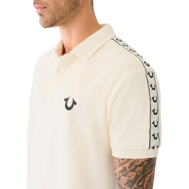 True Religion Mens Polo Shirt
Style Code:  107563
100% Cotton
Made in India
Signature Horseshoe on The Chest
Logo Trim Down The Shoulder Seam
Short Sleeve
Ribbed Collare & Sleeve
Soft Cotton Fabric
Regular Fit
Machine Washable
Split Side Hem