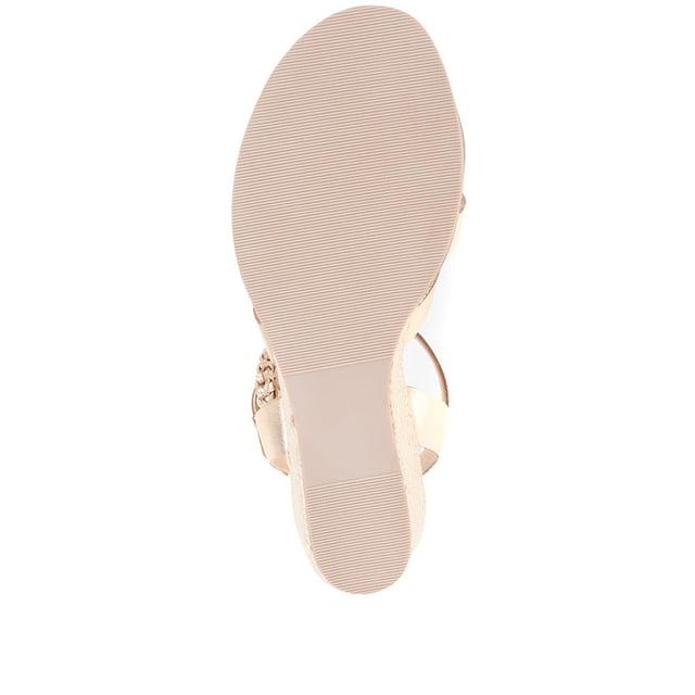 Step up your suave for those summer soirees with this beautifully feminine sandal, seated on a wedge for added comfort. With interwoven straps of leather and leather lining, you'll be on your feet in style all day with no problems.