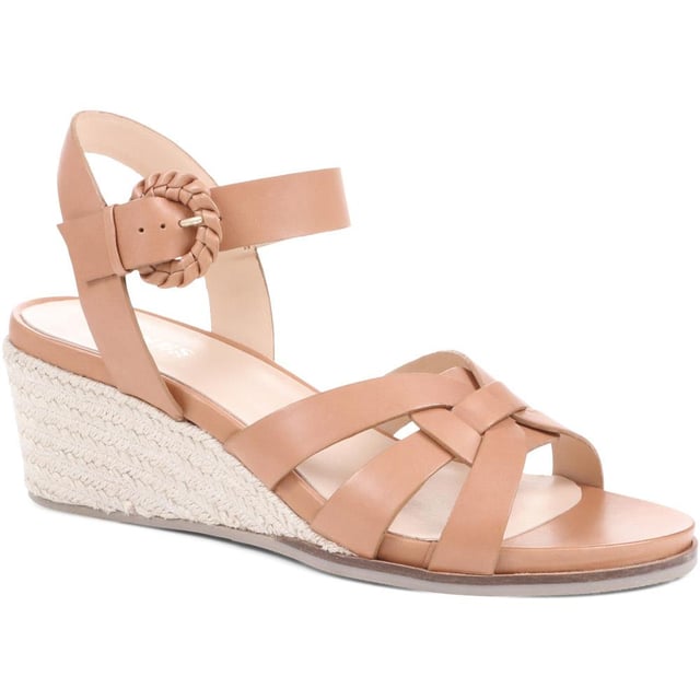 Step up your suave for those summer soirees with this beautifully feminine sandal, seated on a wedge for added comfort. With interwoven straps of leather and leather lining, you'll be on your feet in style all day with no problems.