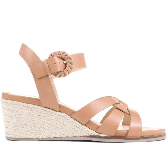 Step up your suave for those summer soirees with this beautifully feminine sandal, seated on a wedge for added comfort. With interwoven straps of leather and leather lining, you'll be on your feet in style all day with no problems.