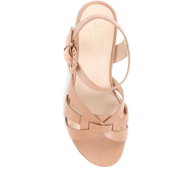 Step up your suave for those summer soirees with this beautifully feminine sandal, seated on a wedge for added comfort. With interwoven straps of leather and leather lining, you'll be on your feet in style all day with no problems.