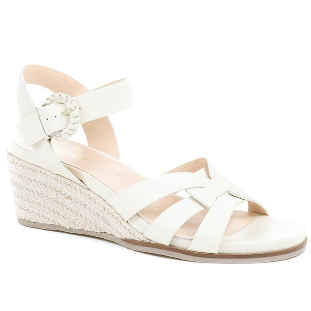 Step up your suave for those summer soirees with this beautifully feminine sandal, seated on a wedge for added comfort. With interwoven straps of leather and leather lining, you'll be on your feet in style all day with no problems.