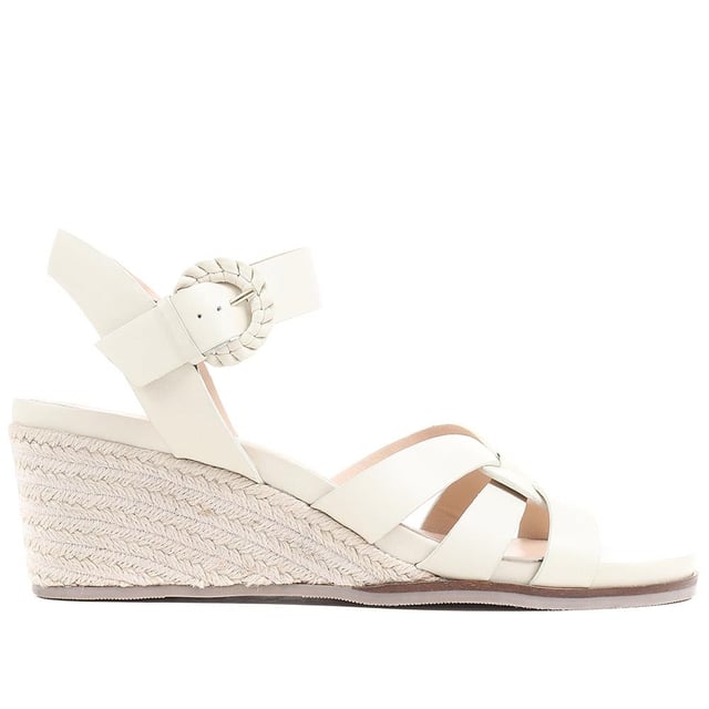 Step up your suave for those summer soirees with this beautifully feminine sandal, seated on a wedge for added comfort. With interwoven straps of leather and leather lining, you'll be on your feet in style all day with no problems.