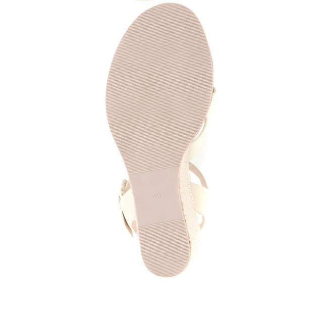 Step up your suave for those summer soirees with this beautifully feminine sandal, seated on a wedge for added comfort. With interwoven straps of leather and leather lining, you'll be on your feet in style all day with no problems.