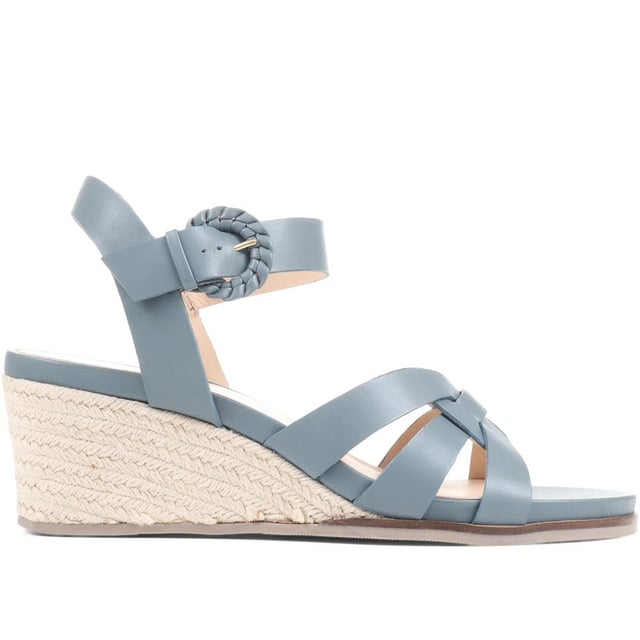 Step up your suave for those summer soirees with this beautifully feminine sandal, seated on a wedge for added comfort. With interwoven straps of leather and leather lining, you'll be on your feet in style all day with no problems.