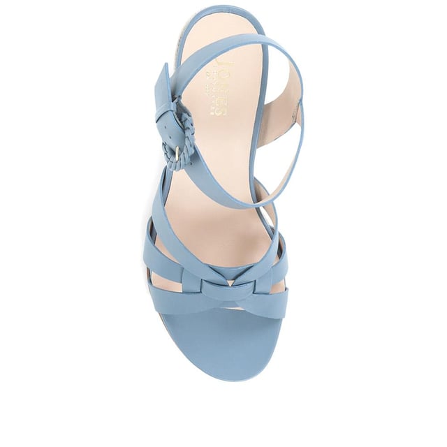 Step up your suave for those summer soirees with this beautifully feminine sandal, seated on a wedge for added comfort. With interwoven straps of leather and leather lining, you'll be on your feet in style all day with no problems.