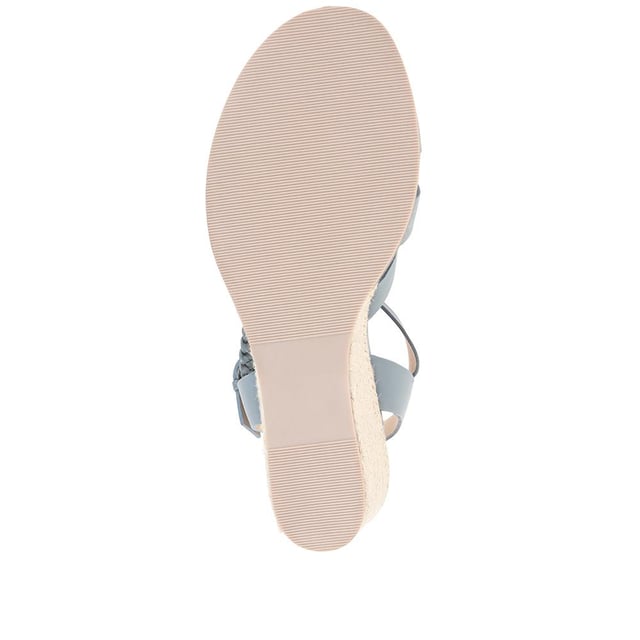 Step up your suave for those summer soirees with this beautifully feminine sandal, seated on a wedge for added comfort. With interwoven straps of leather and leather lining, you'll be on your feet in style all day with no problems.
