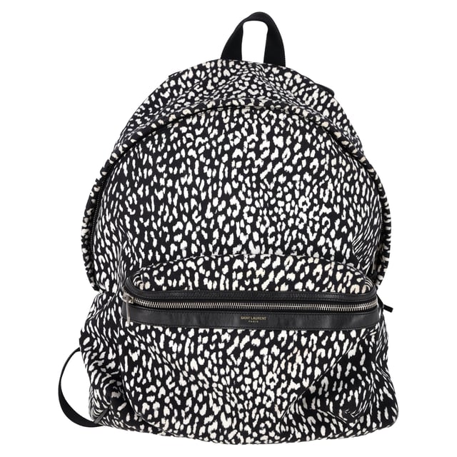 VINTAGE, RRP AS NEW
The Saint Laurent Hunter Leopard Print Backpack in black and white canvas is a bold statement piece for the fashion-forward man. Featuring an eye-catching leopard print pattern, this backpack effortlessly combines streetwear appeal with luxury. Made from durable canvas, it offers ample space with multiple compartments, making it both practical and stylish. The adjustable straps ensure comfort, while the iconic Saint Laurent logo adds a subtle touch of refinement.

Styling Tip:
Pair this standout backpack with a minimalist outfit, like a black t-shirt and slim-fit jeans, to let the bold print take center stage. For a more casual, urban look, wear it with a hoodie, cargo pants, and sneakers. Whether you're out for a day in the city or heading to an event, this Saint Laurent backpack adds a fashionable edge to any outfit.

 Saint Laurent Hunter Leopard Print Backpack in Black and White Canvas

Condition: Excellent
Signs of wear: No retail tag, No visible sign of wear., 
Packaging: None
Color: Print | animal
Material: Canvas 
Size: One Size | One Size
Measurements: Width: 160; Height: 480; Length: 470
SKU: MRPPUGBBA457328M