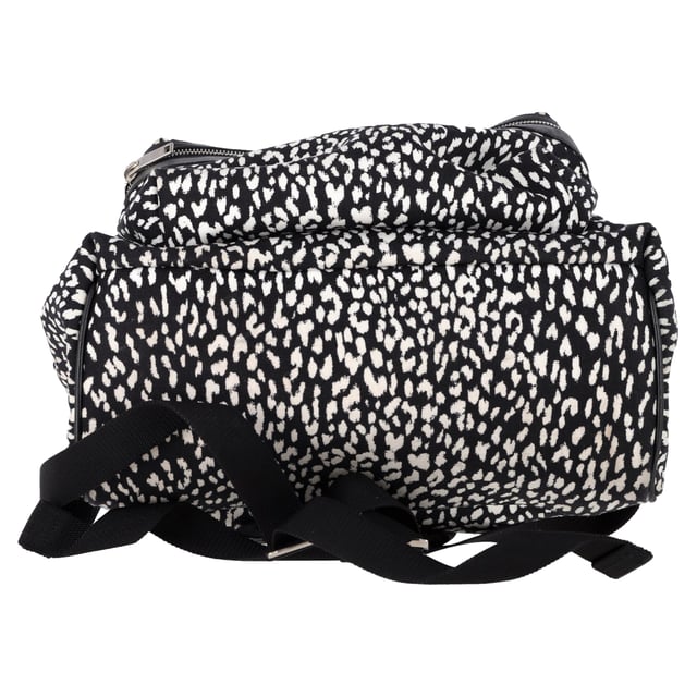 VINTAGE, RRP AS NEW
The Saint Laurent Hunter Leopard Print Backpack in black and white canvas is a bold statement piece for the fashion-forward man. Featuring an eye-catching leopard print pattern, this backpack effortlessly combines streetwear appeal with luxury. Made from durable canvas, it offers ample space with multiple compartments, making it both practical and stylish. The adjustable straps ensure comfort, while the iconic Saint Laurent logo adds a subtle touch of refinement.

Styling Tip:
Pair this standout backpack with a minimalist outfit, like a black t-shirt and slim-fit jeans, to let the bold print take center stage. For a more casual, urban look, wear it with a hoodie, cargo pants, and sneakers. Whether you're out for a day in the city or heading to an event, this Saint Laurent backpack adds a fashionable edge to any outfit.

 Saint Laurent Hunter Leopard Print Backpack in Black and White Canvas

Condition: Excellent
Signs of wear: No retail tag, No visible sign of wear., 
Packaging: None
Color: Print | animal
Material: Canvas 
Size: One Size | One Size
Measurements: Width: 160; Height: 480; Length: 470
SKU: MRPPUGBBA457328M