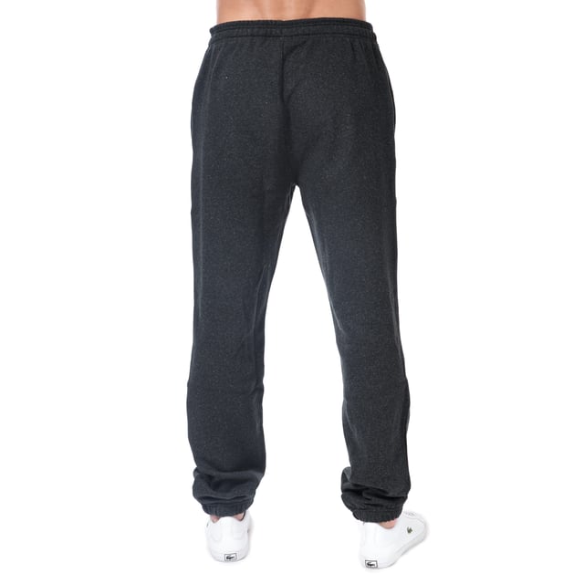 Men's Lacoste Premium Fleece Jog Pant.- 2 side pockets.- Printed Lacoste logo to front.- Fleece lined.- Crocodile logo to hem.- Elasticated waist drawstring ties to waist. Material: 87% Cotton, 13% Polyester. Ref: XH7611EL6.