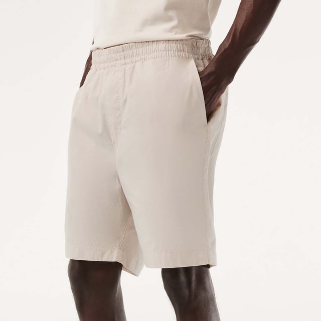 Men's Lacoste Organic Cotton Shorts.- Loose, relaxed fit: Relaxed style.- Elasticated waistband with drawstring: Adjustable, for tailored comfort.- Two pockets on back: Practical and eye-catching.- Crocodile on back pocket: Signed Lacoste.- Organic cotton: Grown without GMO or chemical products. Material: 100% Cotton. Ref: GH7862G7A.