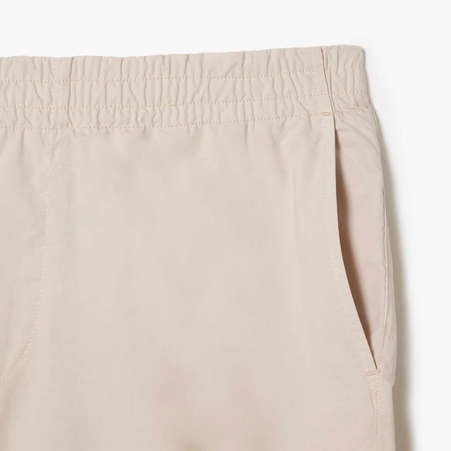 Men's Lacoste Organic Cotton Shorts.- Loose, relaxed fit: Relaxed style.- Elasticated waistband with drawstring: Adjustable, for tailored comfort.- Two pockets on back: Practical and eye-catching.- Crocodile on back pocket: Signed Lacoste.- Organic cotton: Grown without GMO or chemical products. Material: 100% Cotton. Ref: GH7862G7A.