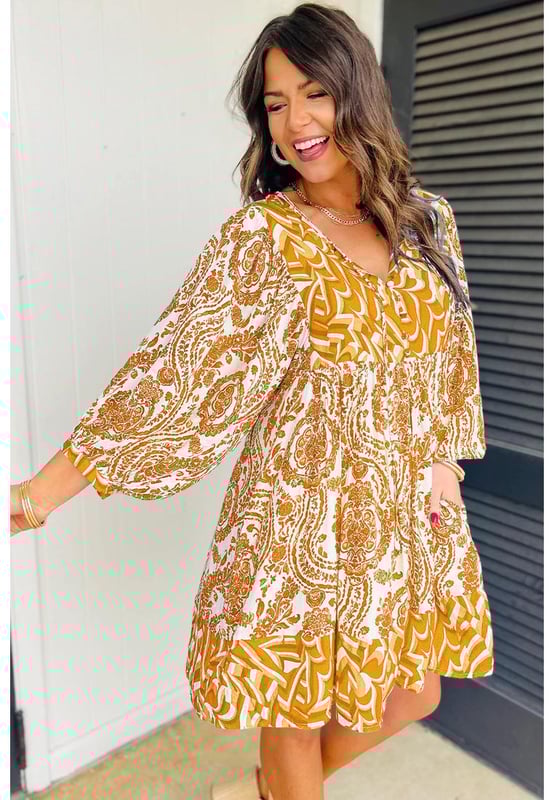 Orange Bohemian Print Puff Sleeve Tied V Neck Flared Mini Dress
  Bohemian paisley print
  Charming puff sleeves
  Tied V
  neckline detail
  Flattering flared silhouette
  Suitable for casual or dressy occasions
  Refer to size chart for perfect fit
Material: 100% Polyester