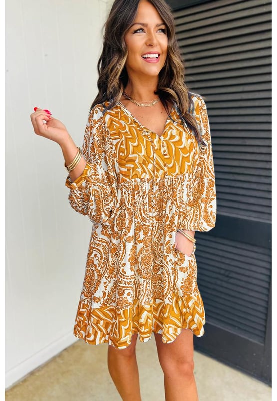 Orange Bohemian Print Puff Sleeve Tied V Neck Flared Mini Dress
  Bohemian paisley print
  Charming puff sleeves
  Tied V
  neckline detail
  Flattering flared silhouette
  Suitable for casual or dressy occasions
  Refer to size chart for perfect fit
Material: 100% Polyester