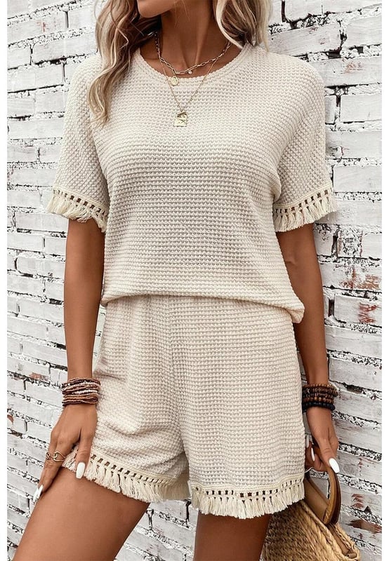 Beige two
  piece set
  Includes tee and shorts
  Textured fabric
  Fringe trim
  Chic boho vibe
  Stylish and comfy
  Perfect for daily and casual occasions
  Refer to size chart for accurate measurements.
Material: 67% Polyester 30% Viscose 3% Elastane