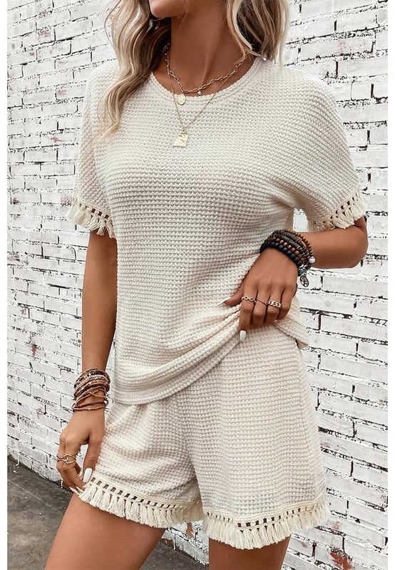Beige two
  piece set
  Includes tee and shorts
  Textured fabric
  Fringe trim
  Chic boho vibe
  Stylish and comfy
  Perfect for daily and casual occasions
  Refer to size chart for accurate measurements.
Material: 67% Polyester 30% Viscose 3% Elastane