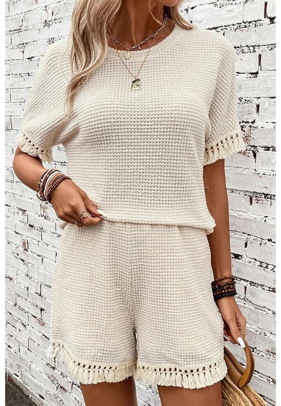 Beige two
  piece set
  Includes tee and shorts
  Textured fabric
  Fringe trim
  Chic boho vibe
  Stylish and comfy
  Perfect for daily and casual occasions
  Refer to size chart for accurate measurements.
Material: 67% Polyester 30% Viscose 3% Elastane