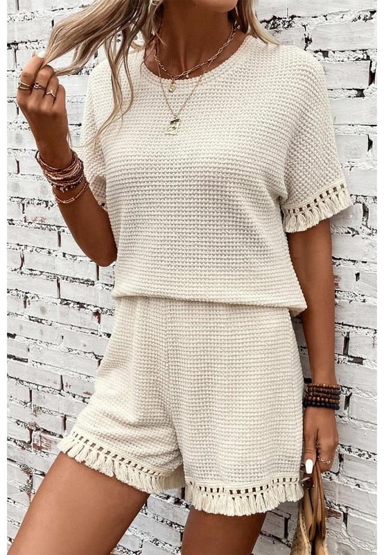 Beige two
  piece set
  Includes tee and shorts
  Textured fabric
  Fringe trim
  Chic boho vibe
  Stylish and comfy
  Perfect for daily and casual occasions
  Refer to size chart for accurate measurements.
Material: 67% Polyester 30% Viscose 3% Elastane