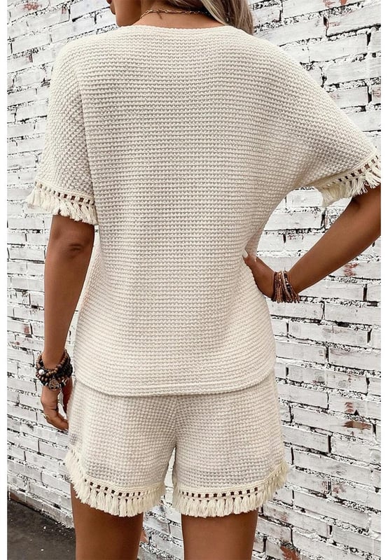 Beige two
  piece set
  Includes tee and shorts
  Textured fabric
  Fringe trim
  Chic boho vibe
  Stylish and comfy
  Perfect for daily and casual occasions
  Refer to size chart for accurate measurements.
Material: 67% Polyester 30% Viscose 3% Elastane