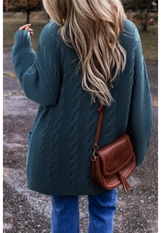 Peacock Blue Cable Knit Button Front Pocketed Baggy Cardigan
  Classic detailing
  Button
  up front
  Side pockets
  Long sleeves
  Captivating patterns and textures
  Refer to size chart for the perfect fit
Material: 65% Acrylic 35% Polyamide