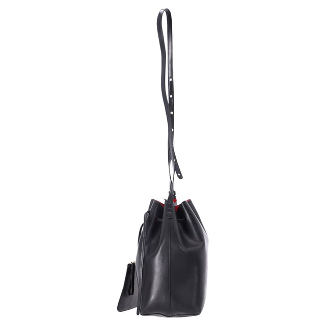 VINTAGE, RRP AS NEW
 The Mansur Gavriel Large Bucket Bag with Pouch in Black Leather is the epitome of understated luxury. Crafted from supple black leather, this spacious bag features a minimalist design with a sleek, cylindrical silhouette. The versatile bag comes with a detachable pouch for added organization, offering both style and practicality. With its smooth leather finish and timeless black color, this bag easily transitions from day to night, making it the perfect everyday accessory for the modern, fashion-conscious individual.

Styling Tip: Pair this elegant bucket bag with a tailored blazer and straight-leg trousers for a chic office look or opt for a flowy dress and ankle boots for a relaxed, weekend ensemble. Its simple design makes it easy to accessorize with bold jewelry or scarves, adding a personalized touch. The classic black leather ensures it complements almost any outfit, whether you're going for a polished or casual vibe.

Mansur Gavriel Large Bucket Bag with Pouch in Black Leather

Condition: Very good
Signs of wear: No retail tag, Minor sign of wear or markings., Lightly used but very well maintained. Minor creasing, light worn corners, light scratches.
Packaging: None
Color: Black
Material: Leather | leather
Size: One Size | One Size
Measurements: Width: 140; Height: 310; Length: 350; Strap length: 1100
SKU: TONPUDEBA457627W