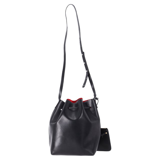 VINTAGE, RRP AS NEW
 The Mansur Gavriel Large Bucket Bag with Pouch in Black Leather is the epitome of understated luxury. Crafted from supple black leather, this spacious bag features a minimalist design with a sleek, cylindrical silhouette. The versatile bag comes with a detachable pouch for added organization, offering both style and practicality. With its smooth leather finish and timeless black color, this bag easily transitions from day to night, making it the perfect everyday accessory for the modern, fashion-conscious individual.

Styling Tip: Pair this elegant bucket bag with a tailored blazer and straight-leg trousers for a chic office look or opt for a flowy dress and ankle boots for a relaxed, weekend ensemble. Its simple design makes it easy to accessorize with bold jewelry or scarves, adding a personalized touch. The classic black leather ensures it complements almost any outfit, whether you're going for a polished or casual vibe.

Mansur Gavriel Large Bucket Bag with Pouch in Black Leather

Condition: Very good
Signs of wear: No retail tag, Minor sign of wear or markings., Lightly used but very well maintained. Minor creasing, light worn corners, light scratches.
Packaging: None
Color: Black
Material: Leather | leather
Size: One Size | One Size
Measurements: Width: 140; Height: 310; Length: 350; Strap length: 1100
SKU: TONPUDEBA457627W