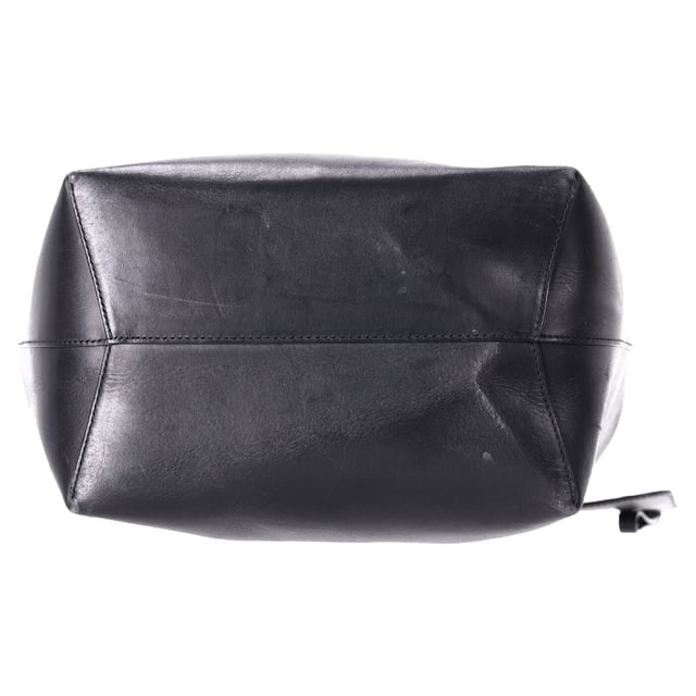 VINTAGE, RRP AS NEW
 The Mansur Gavriel Large Bucket Bag with Pouch in Black Leather is the epitome of understated luxury. Crafted from supple black leather, this spacious bag features a minimalist design with a sleek, cylindrical silhouette. The versatile bag comes with a detachable pouch for added organization, offering both style and practicality. With its smooth leather finish and timeless black color, this bag easily transitions from day to night, making it the perfect everyday accessory for the modern, fashion-conscious individual.

Styling Tip: Pair this elegant bucket bag with a tailored blazer and straight-leg trousers for a chic office look or opt for a flowy dress and ankle boots for a relaxed, weekend ensemble. Its simple design makes it easy to accessorize with bold jewelry or scarves, adding a personalized touch. The classic black leather ensures it complements almost any outfit, whether you're going for a polished or casual vibe.

Mansur Gavriel Large Bucket Bag with Pouch in Black Leather

Condition: Very good
Signs of wear: No retail tag, Minor sign of wear or markings., Lightly used but very well maintained. Minor creasing, light worn corners, light scratches.
Packaging: None
Color: Black
Material: Leather | leather
Size: One Size | One Size
Measurements: Width: 140; Height: 310; Length: 350; Strap length: 1100
SKU: TONPUDEBA457627W