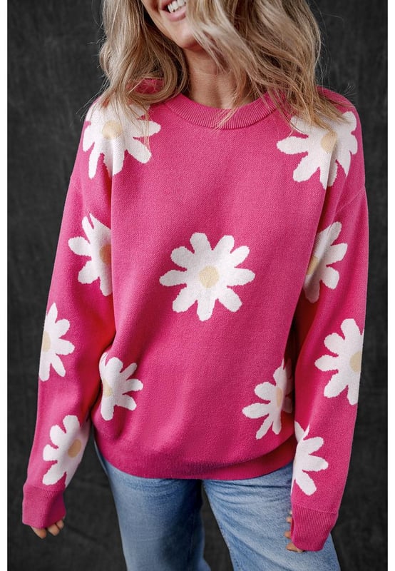 Impresión de flores de margarita en rosa brillante  
Cuello redondo clásico  
Mangas largas  
Construcción de punto con ribete acanalado  
Material: 57% Viscosa 27% Poliéster 16% Poliamida