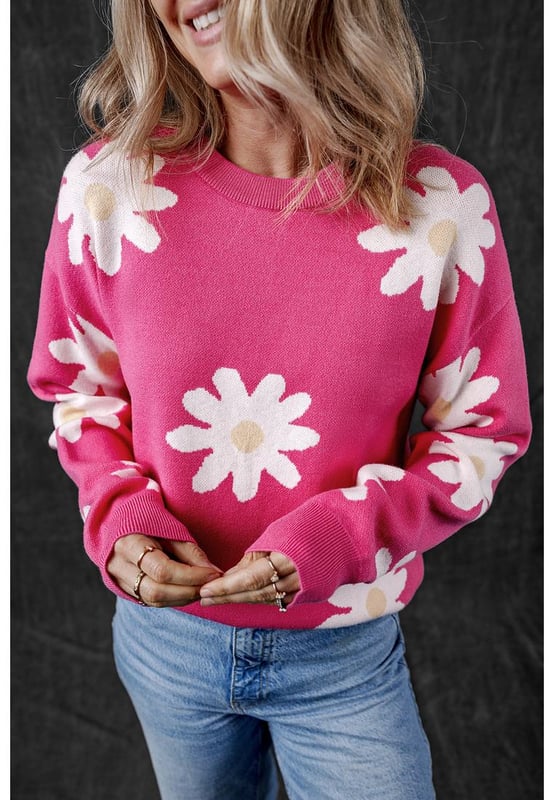 Impresión de flores de margarita en rosa brillante  
Cuello redondo clásico  
Mangas largas  
Construcción de punto con ribete acanalado  
Material: 57% Viscosa 27% Poliéster 16% Poliamida