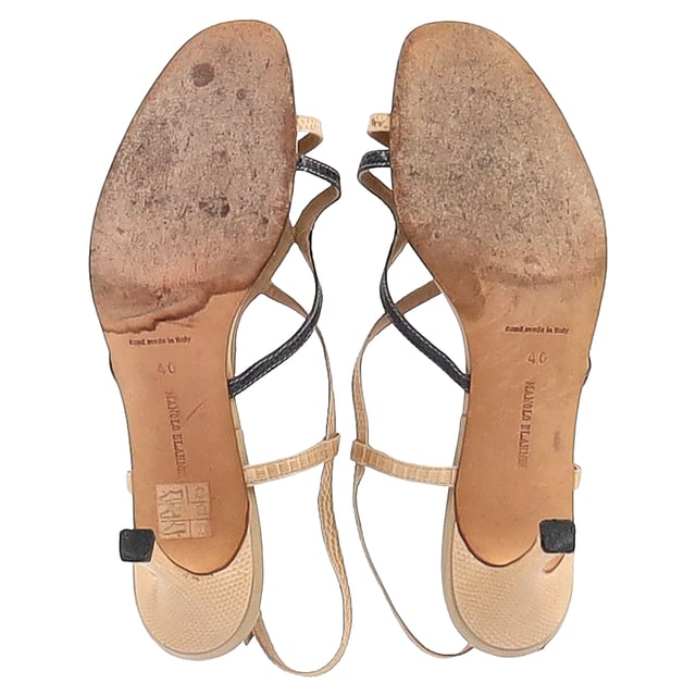 VINTAGE, RRP AS NEW
 Experience luxury with the Manolo Blahnik Snakeskin-Embossed Sandal Heels in nude leather. These exquisitely crafted heels feature a sleek snakeskin-embossed pattern, adding texture and sophistication to the timeless design. The soft nude leather ensures a versatile, neutral look, while the elegant straps and slim stiletto heel elongate the legs, creating a refined silhouette. Perfect for any occasion, these sandals are the epitome of understated glamour.

Styling Tip: Pair these Manolo Blahnik sandals with an elegant cocktail dress or a tailored jumpsuit for a chic, sophisticated look. They also complement wide-leg trousers or a midi skirt for a more contemporary, fashion-forward vibe. Whether you're attending a wedding, dinner party, or a night out, these sandals will effortlessly elevate your ensemble with their luxurious, statement-making design.

Manolo Blahnik Snakeskin-Embossed Sandal Heels in Nude Leather

Condition: Very good
Signs of wear: Include Box., Minor markings, Lightly used but very well maintained. Minor mark at soles & creasing, light scuffing at the soles and heels.
Packaging: Box
Color: Brown | nude
Material: Leather | leather
Size: IT | 40
Measurements: Insole length: 230
SKU: NAPPUGBSH458396W