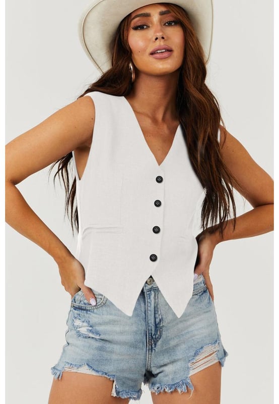 Classic solid color for a timeless and versatile look
  V
  neckline adds a touch of elegance to your outfit
  Button closure for a polished and adjustable fit
  Perfect for layering and adding sophistication
Material: 85% Polyester 10% Viscose 5% Elastane