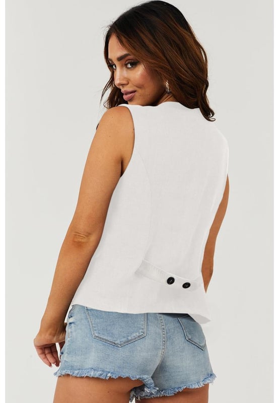Classic solid color for a timeless and versatile look
  V
  neckline adds a touch of elegance to your outfit
  Button closure for a polished and adjustable fit
  Perfect for layering and adding sophistication
Material: 85% Polyester 10% Viscose 5% Elastane