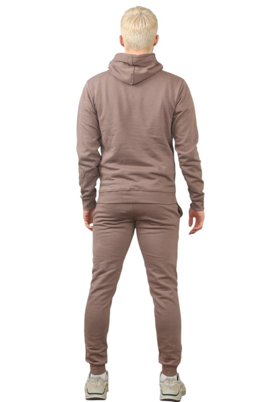 The Pepe Jeans London men's regular fit tracksuit set offers a soft and lightweight hoodie paired with matching joggers. The hoodie features ribbed details on the hood, cuffs, and hem, along with an adjustable hood and a kangaroo pocket for convenience. The joggers come with a waistband drawstring for a secure fit. Both pieces showcase the Pepe Jeans London Big logo on the chest for the hoodie and the small logo on left leg for the joggers. A decorative inner neckband with an all-over logo adds a stylish touch. Made from 100% sustainable cotton, the fabric consists of 65% cotton and 35% polyester. The set is a washable machine for easy maintenance.