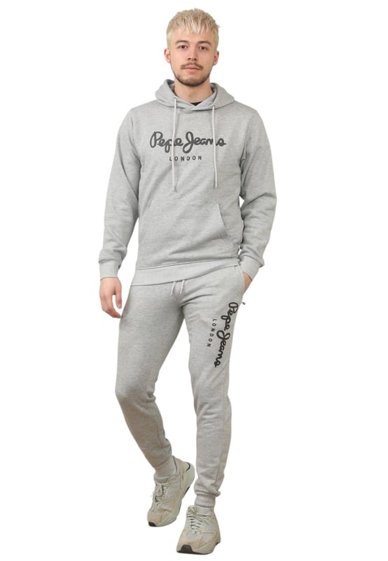 The Pepe Jeans London men's regular fit tracksuit set offers a soft and lightweight hoodie paired with matching joggers. The hoodie features ribbed details on the hood, cuffs, and hem, along with an adjustable hood and a kangaroo pocket for convenience. The joggers come with a waistband drawstring for a secure fit. Both pieces showcase the Pepe Jeans London Big logo on the chest for the hoodie and the left leg for the joggers. A decorative inner neckband with an all-over logo adds a stylish touch. Made from 100% sustainable cotton, the fabric consists of 65% cotton and 35% polyester. The set is a washable machine for easy maintenance.