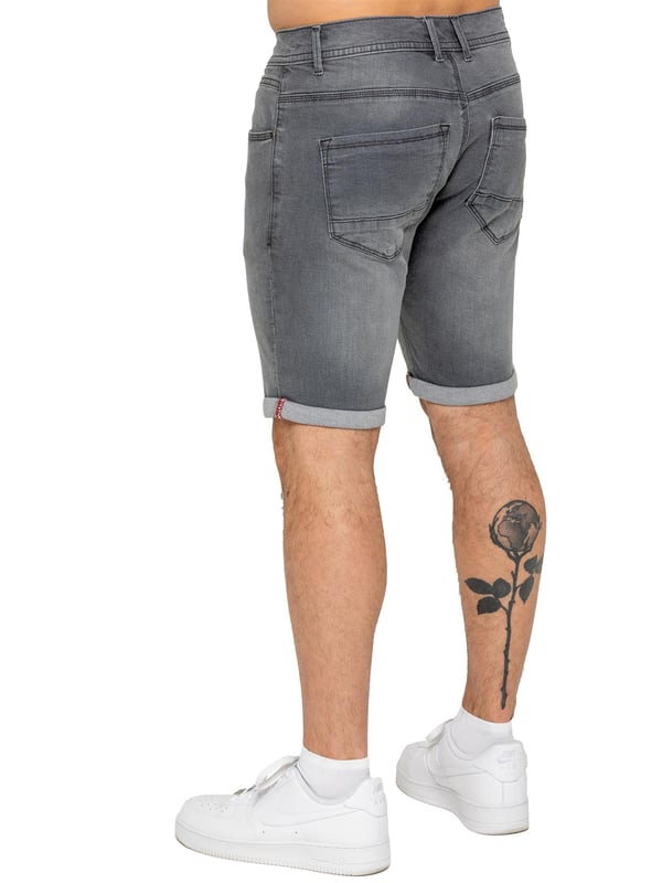 The Enzo Men's Denim Stretch Shorts offer the perfect blend of style and comfort. Designed with a slim fit and crafted from stretch fabric, they provide flexibility and a sleek look. Featuring a classic 5-pocket design, a zip fly fastening, and a turn-up hem for a modern touch, these shorts are a must-have for any casual wardrobe. Ideal for warm-weather styling, they deliver both practicality and effortless fashion.