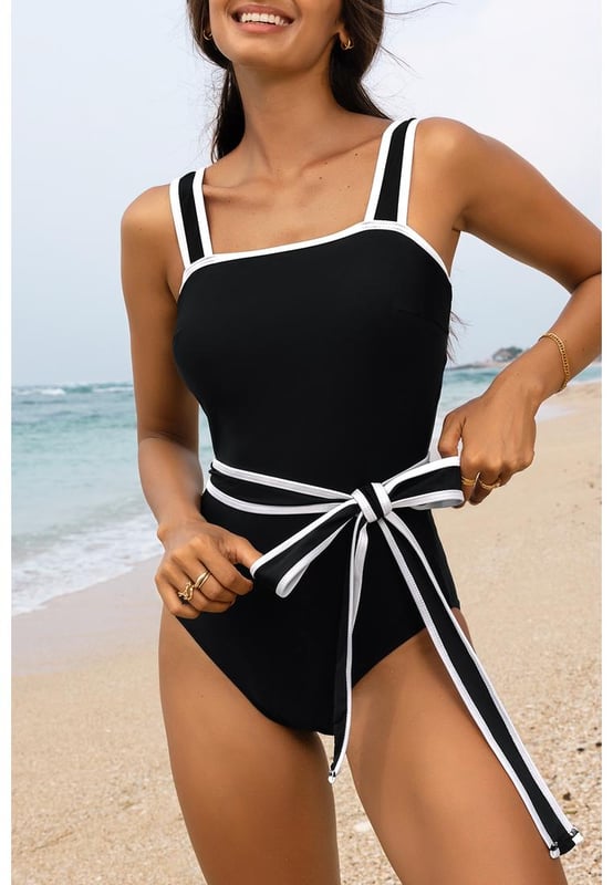 Comfortable support with shoulder strap swimwear
  Striking contrast trim for a dynamic and eye
  catching element
  Waist tie feature for a flattering and customizable fit
  Sleek and streamlined one
  piece design
  Suitable for various body types and sizes
Material: 82% Polyamide 18% Elastane