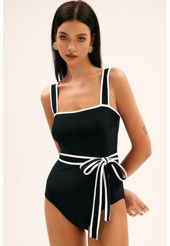 Comfortable support with shoulder strap swimwear
  Striking contrast trim for a dynamic and eye
  catching element
  Waist tie feature for a flattering and customizable fit
  Sleek and streamlined one
  piece design
  Suitable for various body types and sizes
Material: 82% Polyamide 18% Elastane