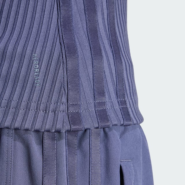Whether you're crushing cardio, lifting weights or stretching it out, this training tank top moves with you. Stay dry, thanks to adidas AEROREADY. Subtle shine details and tonal 3-Stripes round out the look of this versatile must-have. This product is made with at least 70% recycled materials. By reusing materials that have already been created, adidas help to reduce waste and our reliance on finite resources and reduce the footprint of the products adidas make.  - This model is 178 cm and wears a size 36. Their chest measures 81 cm and the waist 58 cm. - Tight fit - Crewneck - 89% polyester (recycled), 11% elastane - Soft feel - AEROREADY - Moisture-wicking fabric  Shipped by adidas